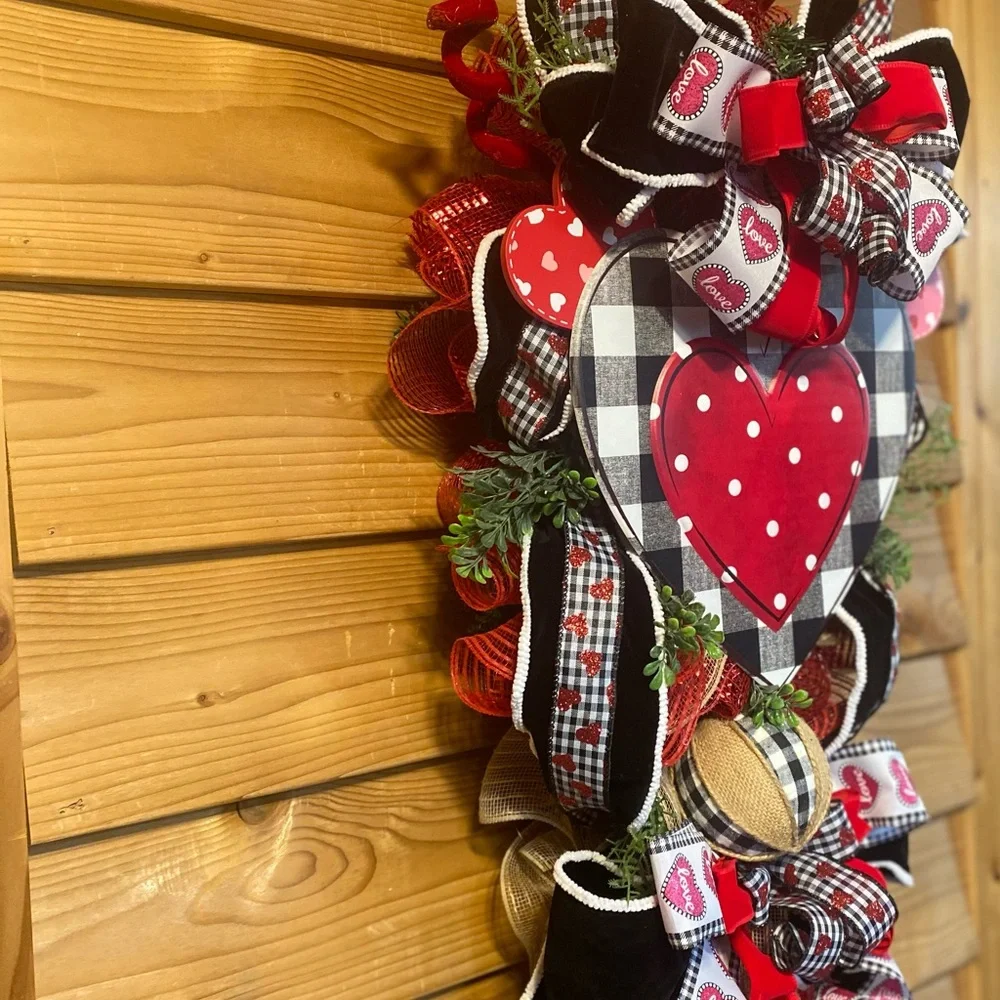 Heart-Themed Holiday Wreath with Red and Black Accents